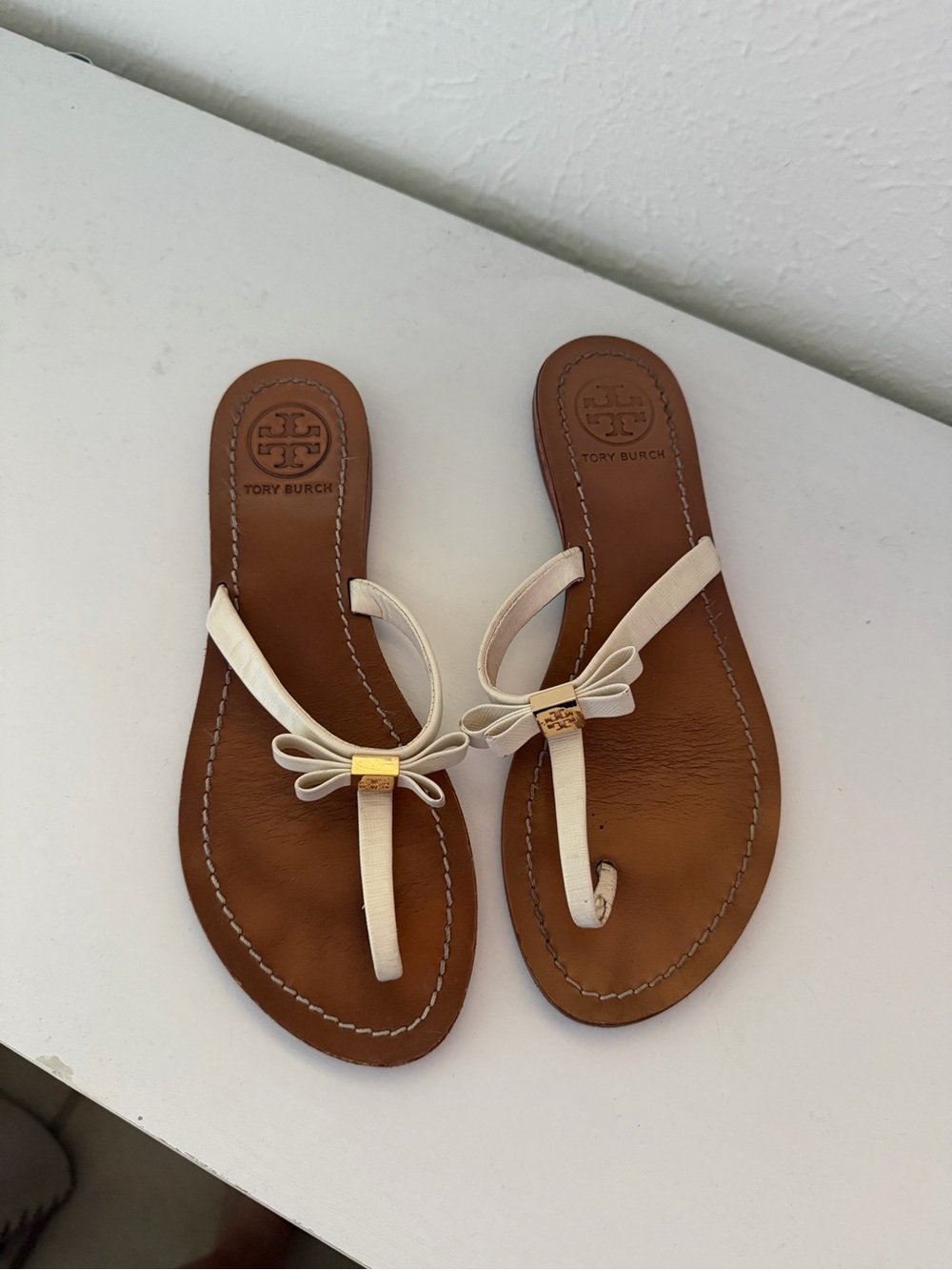 Tory Burch Cream Leather Bow Thong Sandals with Gold Accent